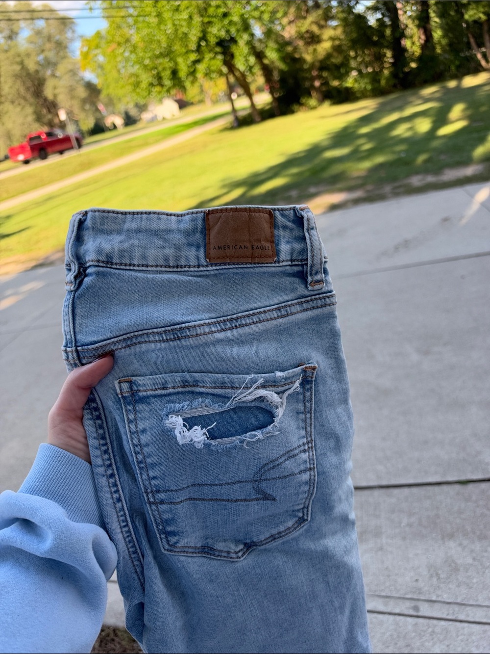 American Eagle Outfitters Light Wash Skinny Jeans with Back Pocket Distress